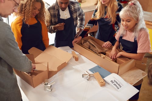 multi-cultural-team-in-workshop-unpacking-and-asse-2024-10-19-04-40-31-utc